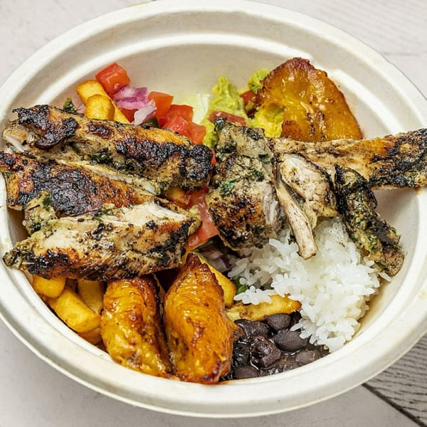 Picaso Chicken's grilled chicken bowl with rice, black beans, plantains, fries, and salad.