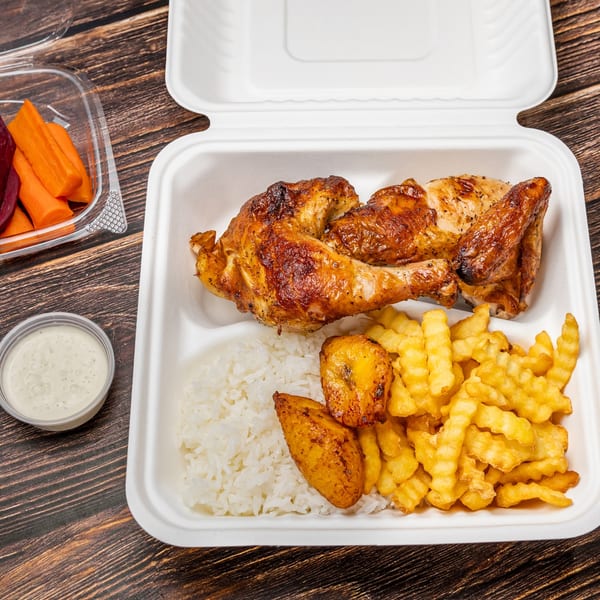 Picaso Chicken's grilled chicken meal with rice, fries, plantains, and a side of carrots.